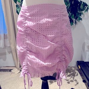 Junior/women’s lavender skirt. Drawstring feature. Size med. Length adjustable.